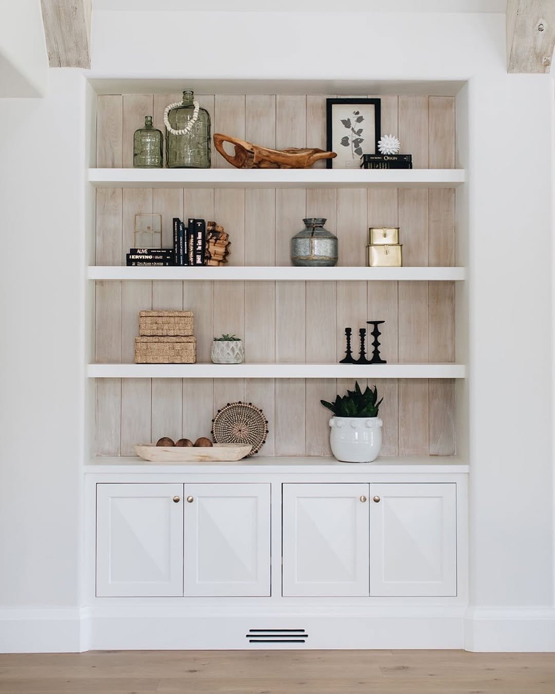 Bookshelf with herb pots on shelves