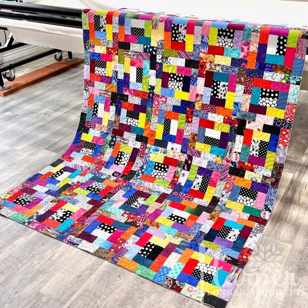 colorful fabric scrap quilt with patchwork design