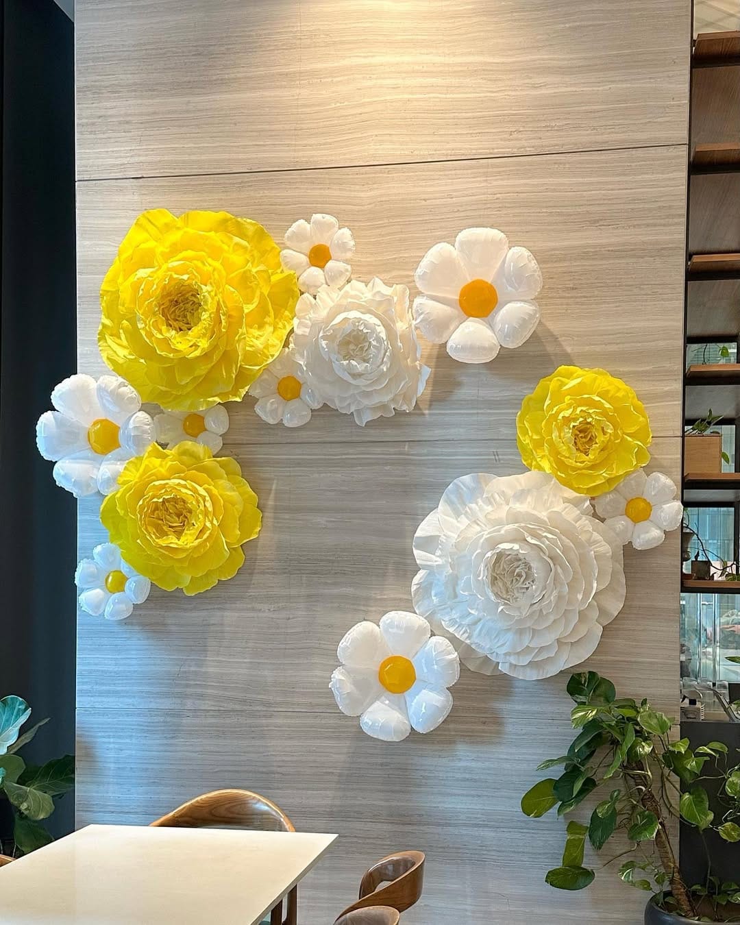 Wall covered in large paper flowers