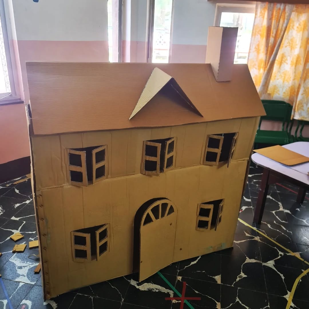 DIY cardboard playhouse with painted designs