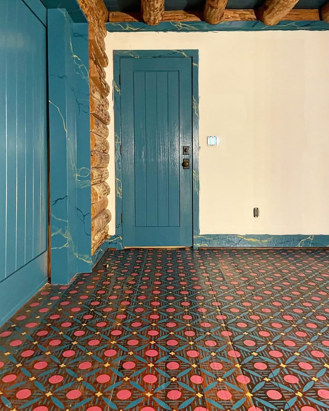 stenciled floor pattern in a hallway
