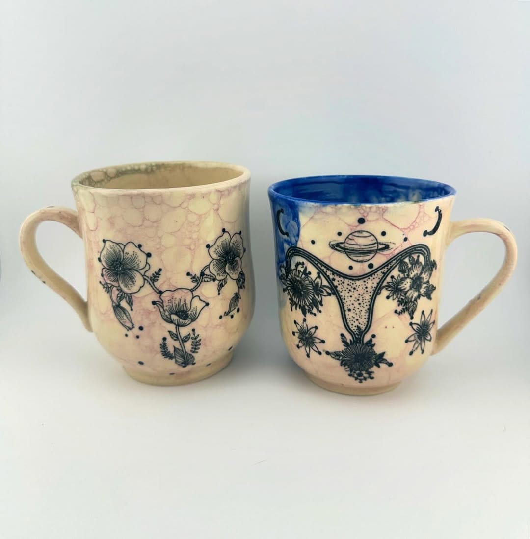 hand-painted ceramic mugs with vibrant designs