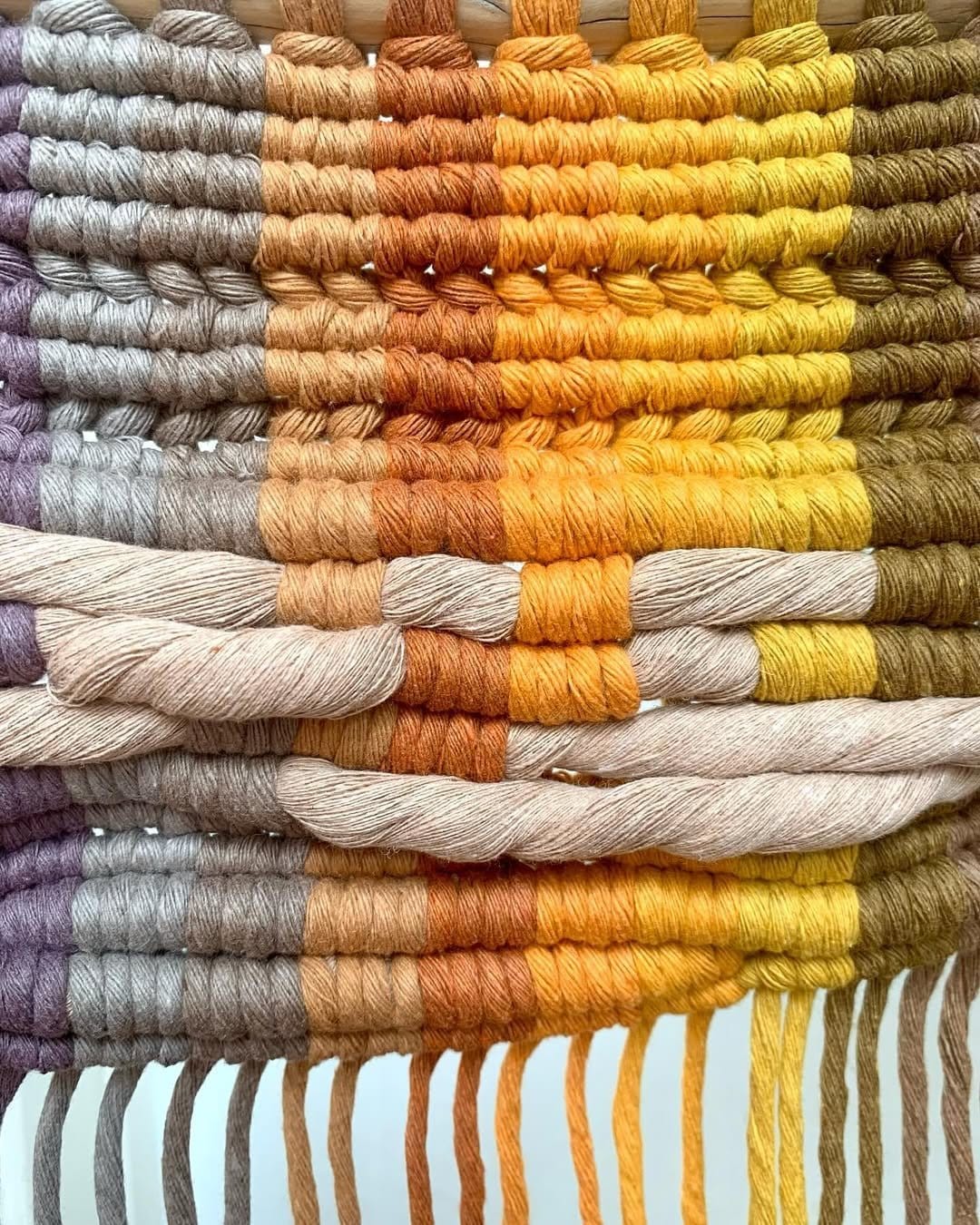 Colorful yarn fringe wall hanging