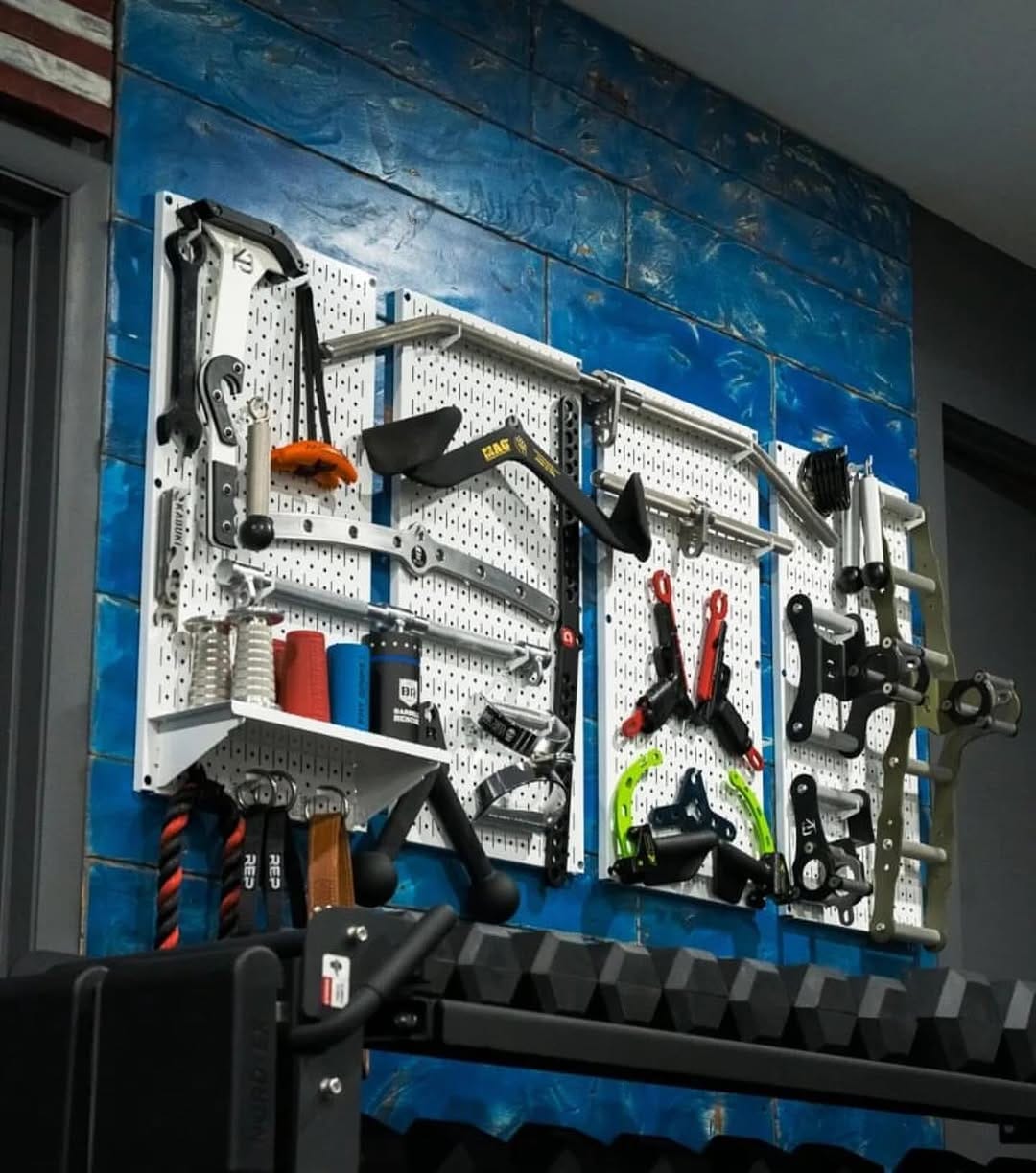 wall-mounted pegboard with organizing tools