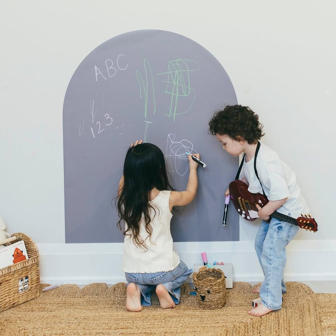 black chalkboard wall with colorful chalk drawings