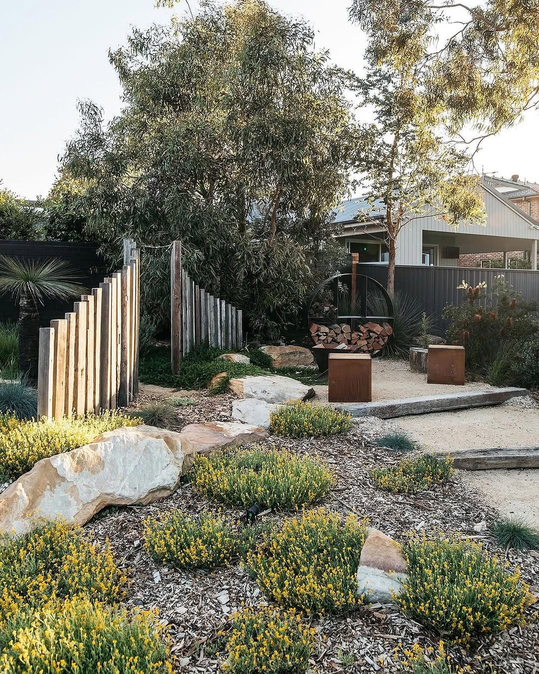 painted stones with intricate designs in a garden bed