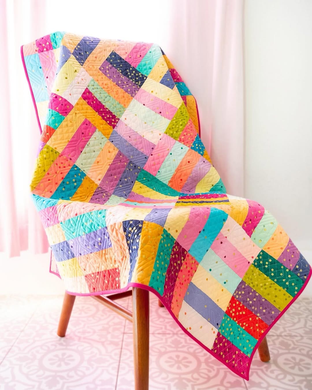 colorful patchwork quilt draped over a chair