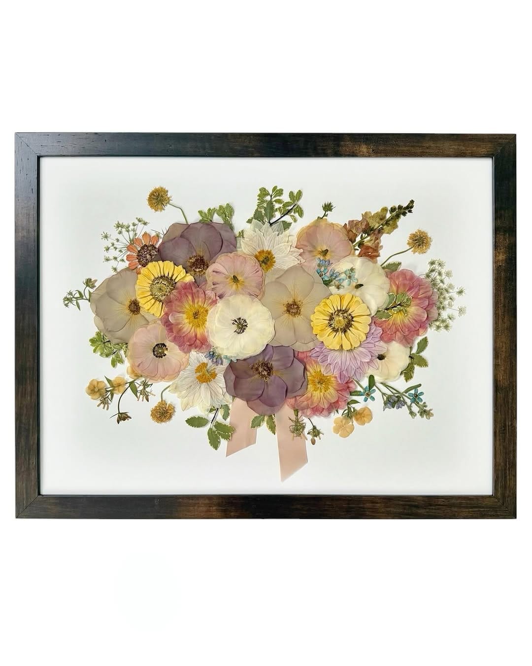 pressed flower artwork in picture frame