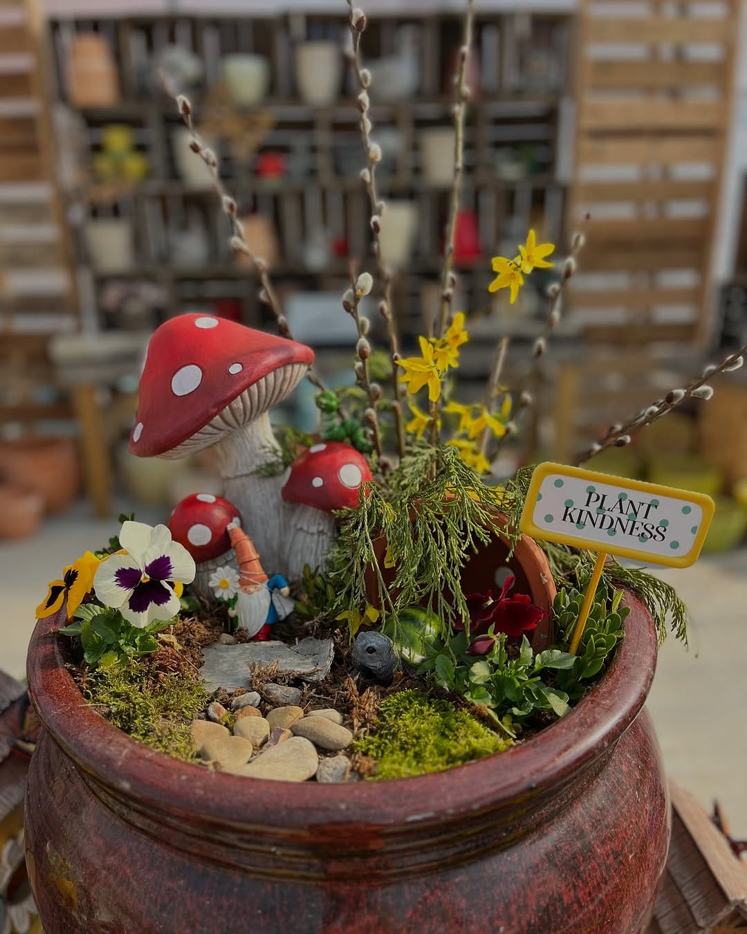 whimsical fairy garden in large pot