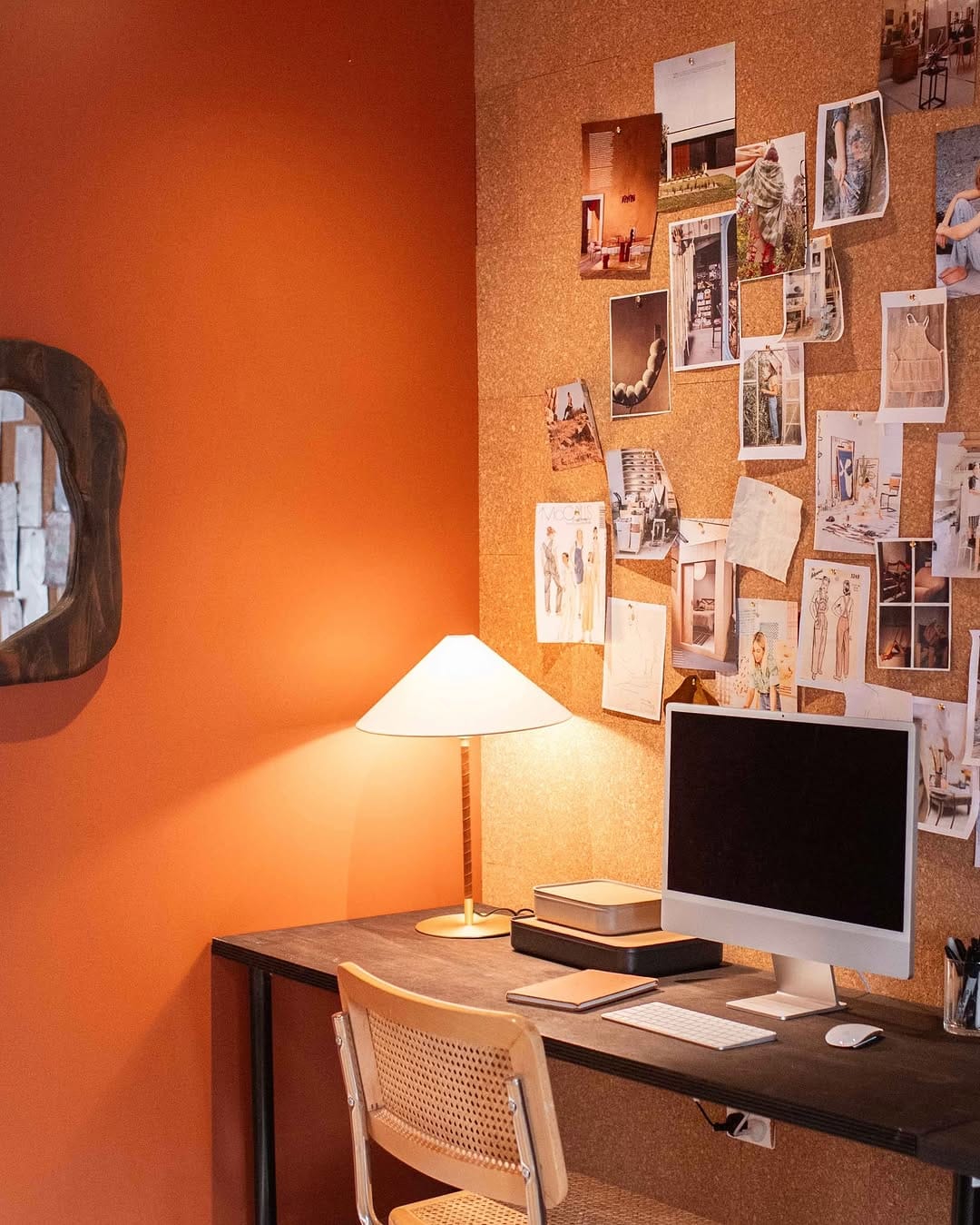corkboard with outfit inspiration in a closet