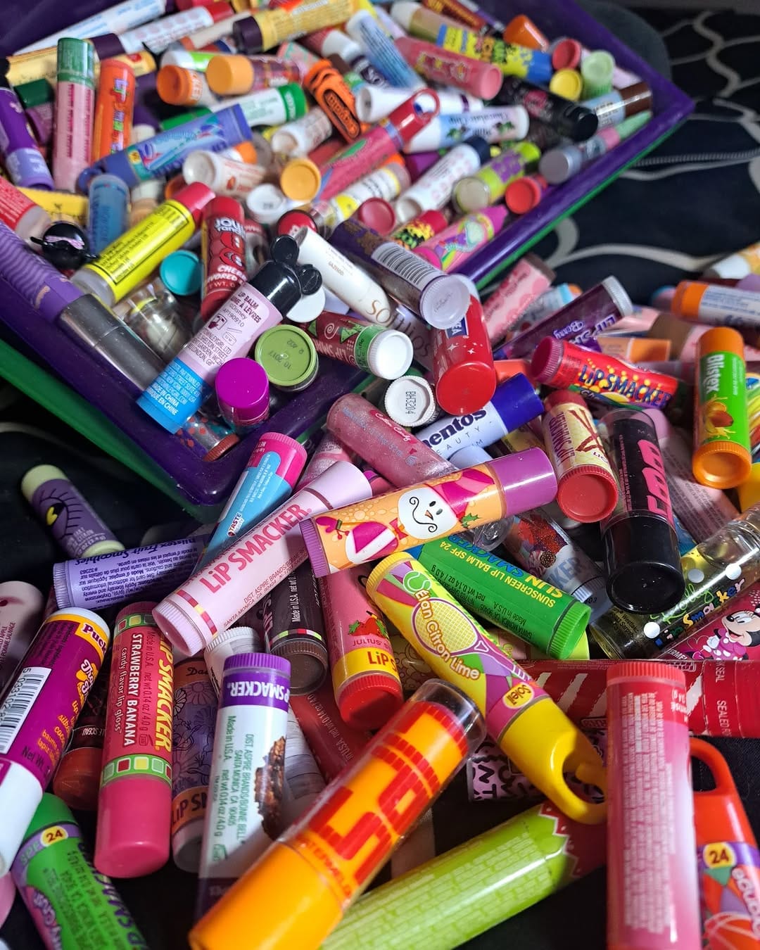 assorted homemade lip balms in tins