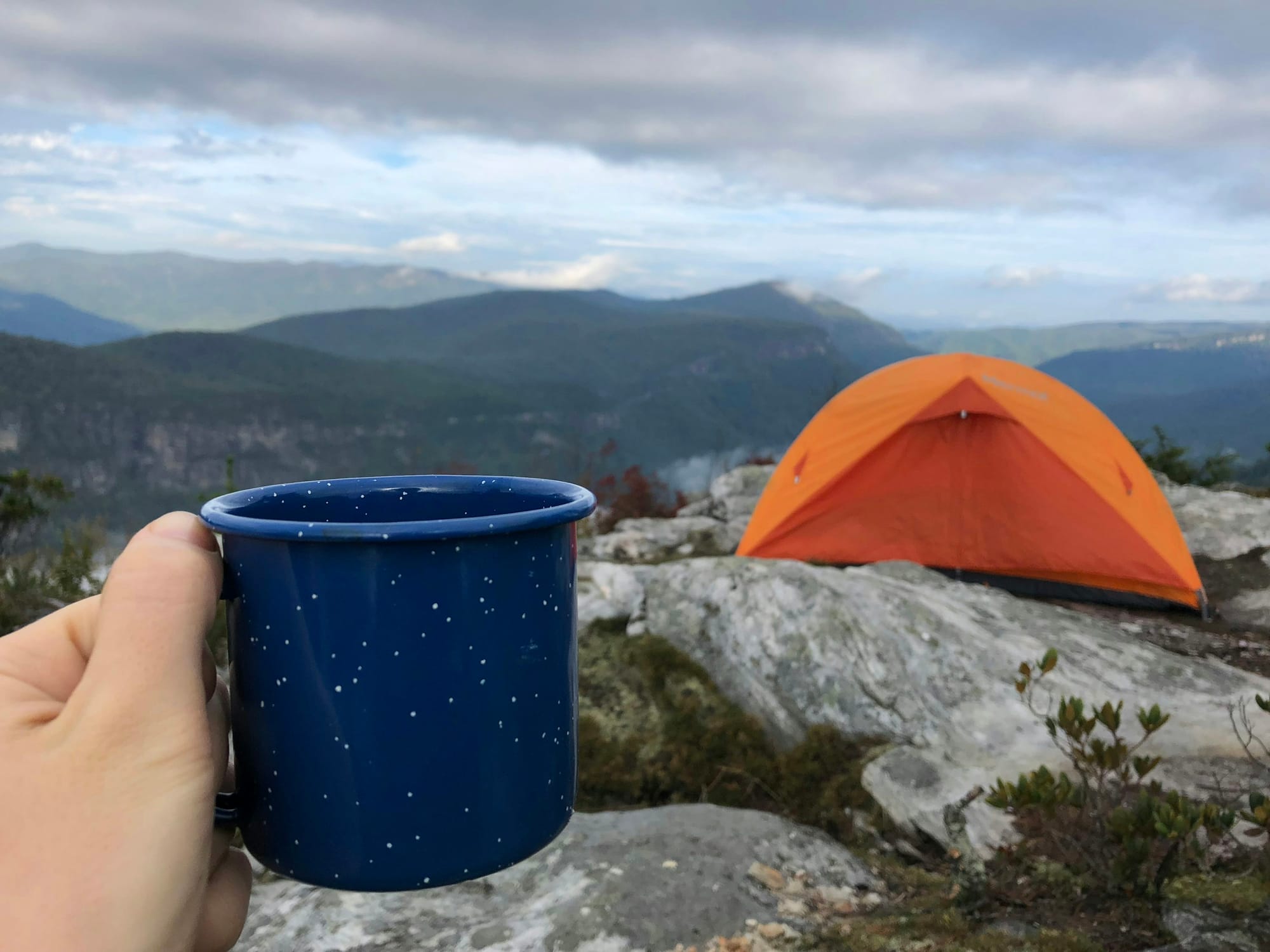 portable espresso maker on a mountain top